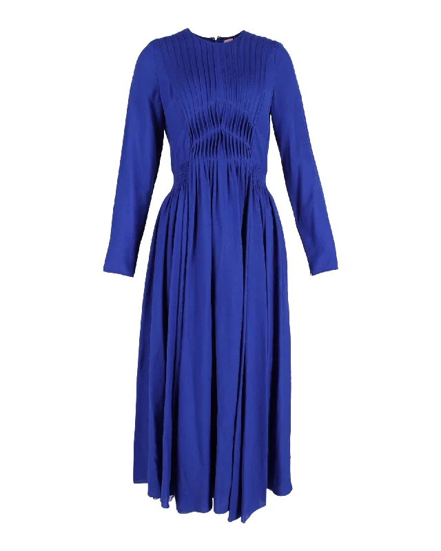 Layering dresses for versatile stylingGabriela Hearst Herminia Pleated Midi Dress in Blue Silk