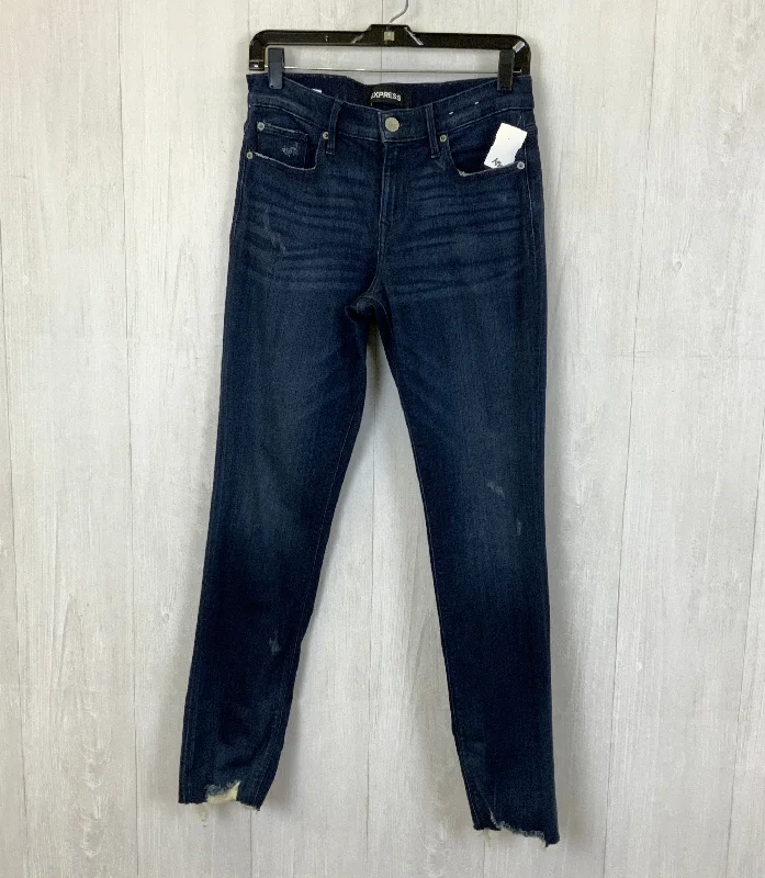 Jeans with a cropped length and rolled-up cuffs for a trendy lookJeans Cropped By Express In Blue Denim, Size: 6