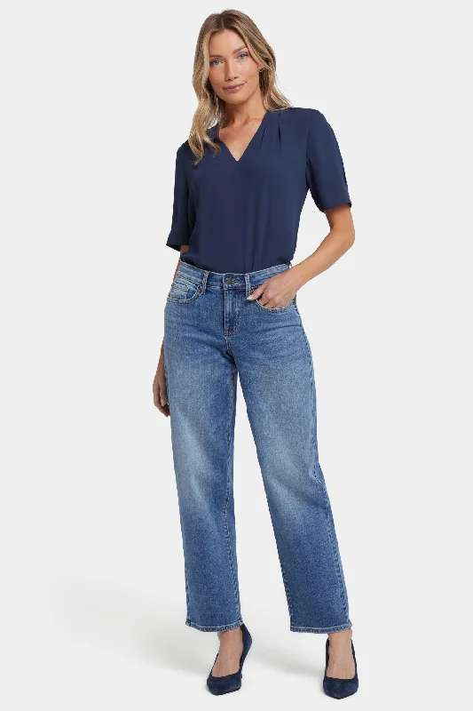 Light wash jeans with rips and tears for a casual vibeJemma Barrel Jeans - Barcelona Breeze