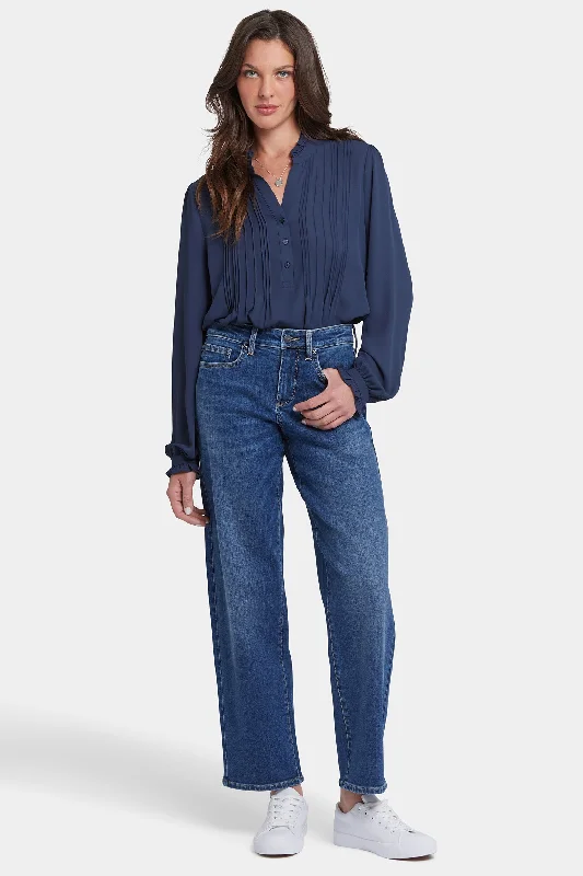 Jeans with a raw hem for an unfinished and rugged lookJemma Barrel Jeans - Asturia Shore