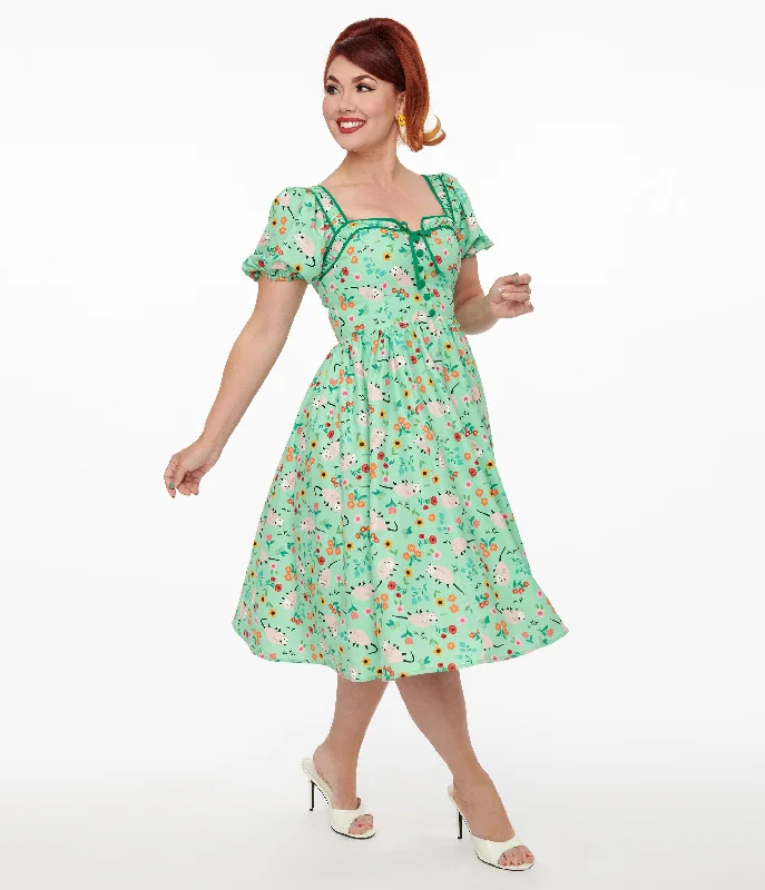 Festival dresses for music and arts eventsUnique Vintage 1940s Green Possum Print Button Front Dress