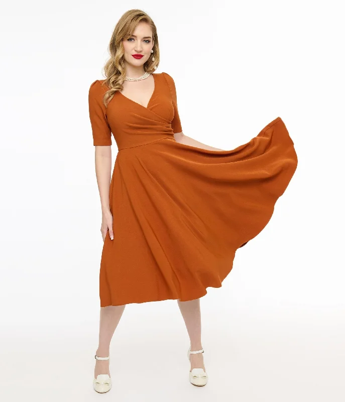 Statement dresses for making a fashion statementVoodoo Vixen 1950s Orange Wrapover Swing Dress